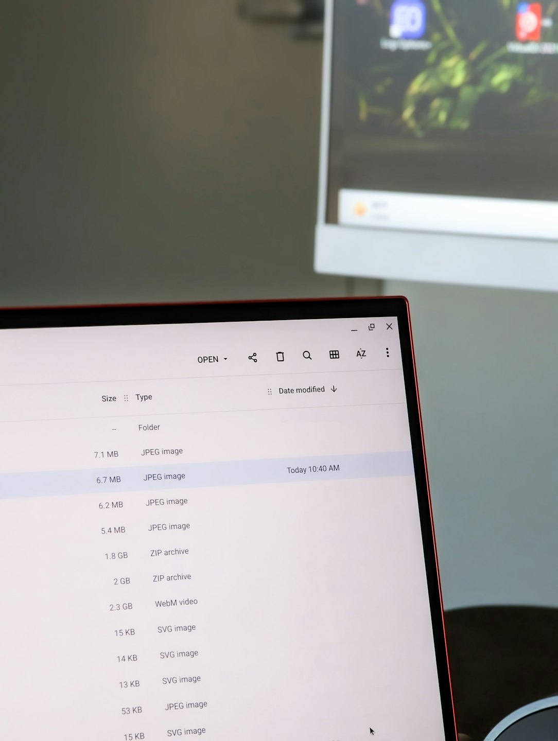 Laptop screen displaying a list of organized digital files.